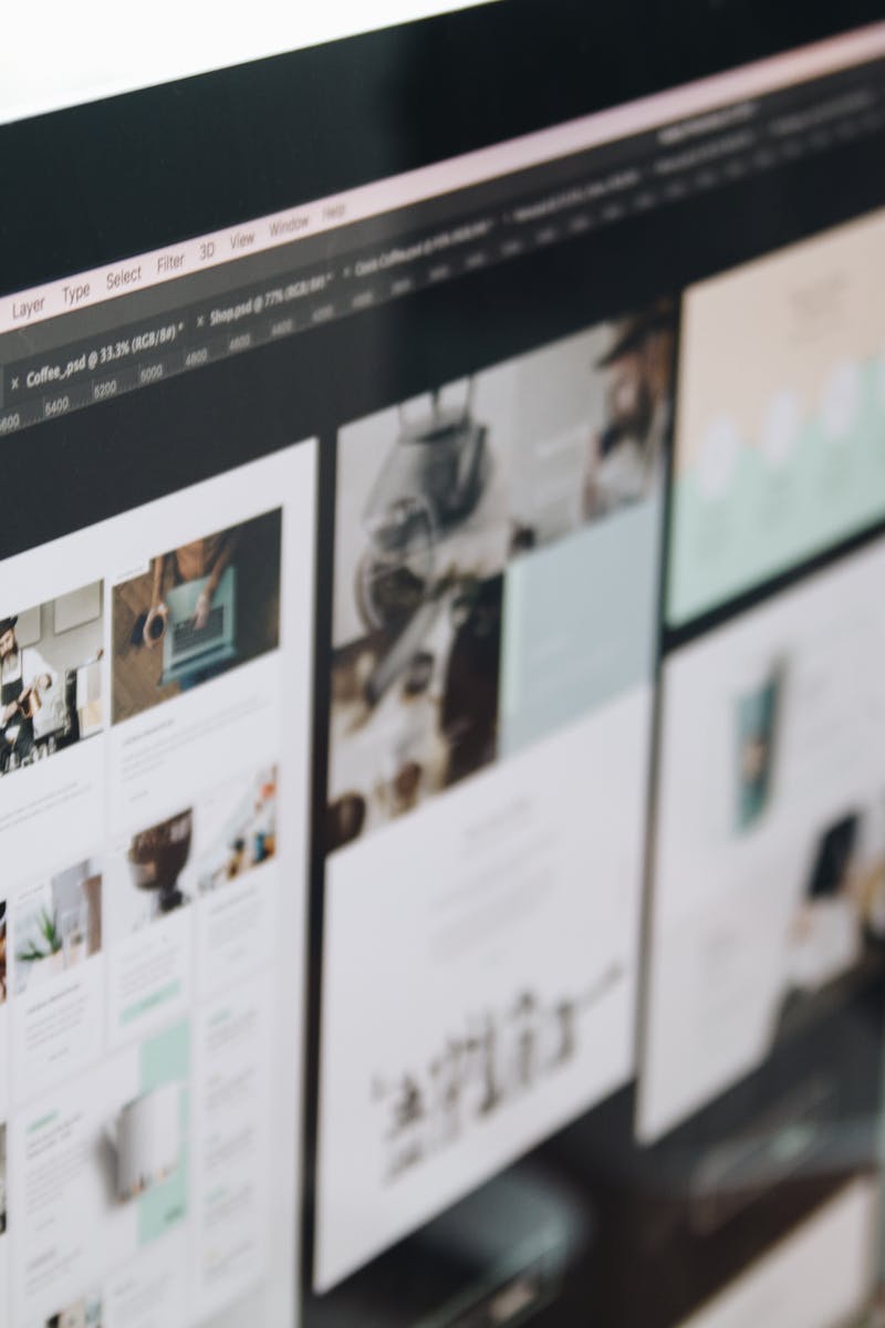 A modern computer screen displaying web design work, showcasing creative visuals in a workspace.